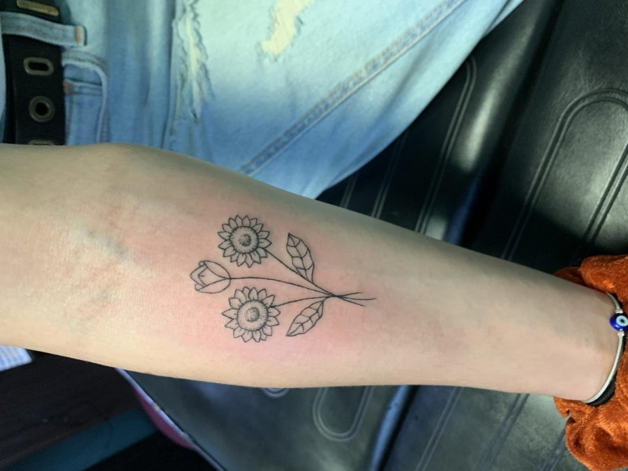 Senior Kieren Garner shows off new tattoo. Before turning 18, Garner decided she wanted to get a tattoo and went through a thought out process to make sure the work came out the way she wanted. To make sure others dont make a mistake in rushing their tattoo, Garner offers advice through her own process. 