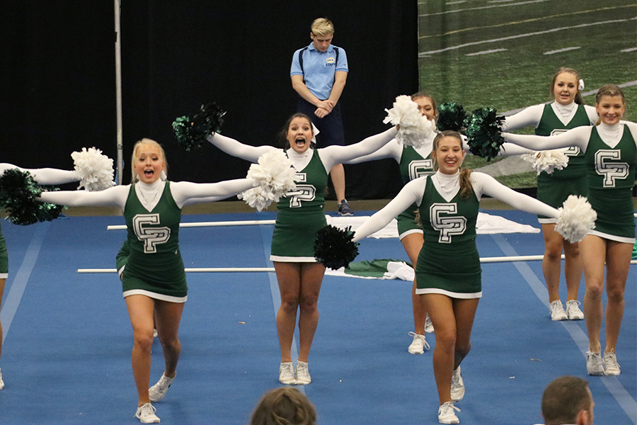 Varsity+cheerleaders+perform+during+the+cheer+regional+competition+on+Oct.+17.+After+regionals%2C+the+team+moved+to+the+state+competition+where+they+placed+fifth.+%E2%80%9CWe+know+that+fifth+is+in+state+is+still+an+awesome+rank%2C+but+just+to+know+that+our+routine+could%E2%80%99ve+been+better+is+still+%5Bdisappointing%5D%2C+senior+cheer+captain+Alyssa+King+said.+%0AOn+the+bright+side%2C+our+loss+has+only+encouraged+us+to+bring+our+A+game+to+our+first+national+competition+in+Florida.%E2%80%9D
