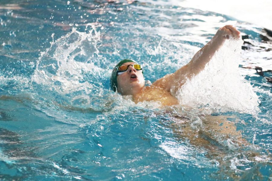 Performing the backstroke, sophomore Evan Alsobrook competes at districts for swim on Jan. 17. Districts took place at Burnet this year. The motivation and support that my fellow teammates gave was what helped me succeed, Alsobrook said. My mindset during competition was just to go fast. 