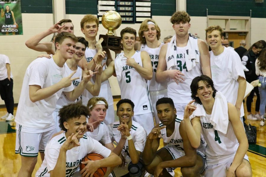 Posing for a picture, the boys varsity team celebrates their second straight district title. The trophy was awarded to the team after they beat Marble Falls on Friday night, 65-37. A district championship as a senior is the perfect way to end our district play, senior PF Luke Ferguson said. You leave the high school knowing that you were the best in the district.