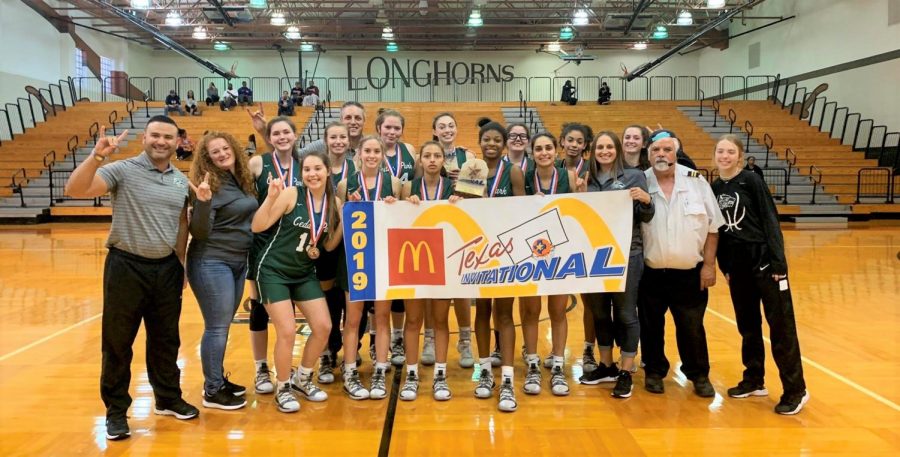 Cedar Park Lady Timberwolves basketball team poses after first place success in the McDonalds Invitational Tournament. The team finished 33-4 overall and broke school history by competing in the Regional Finals for the first time. We had a lot of success this season, and shout out to our coaches for all the preparation they did to help us succeed the way we did, senior guard Donya Yazdi said. 