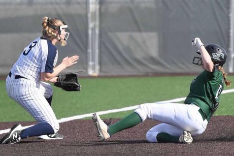 Sliding into third base, senior outfielder Katy Kahlich gets into better scoring position for the batter. Kahlich has been on the varsity softball team for four years. “It’s just disappointing knowing we have a lot of talent and a lot of us seniors don’t get the senior experience,” Kahlich said. “It’s upsetting just not experiencing not enjoying our final season.”