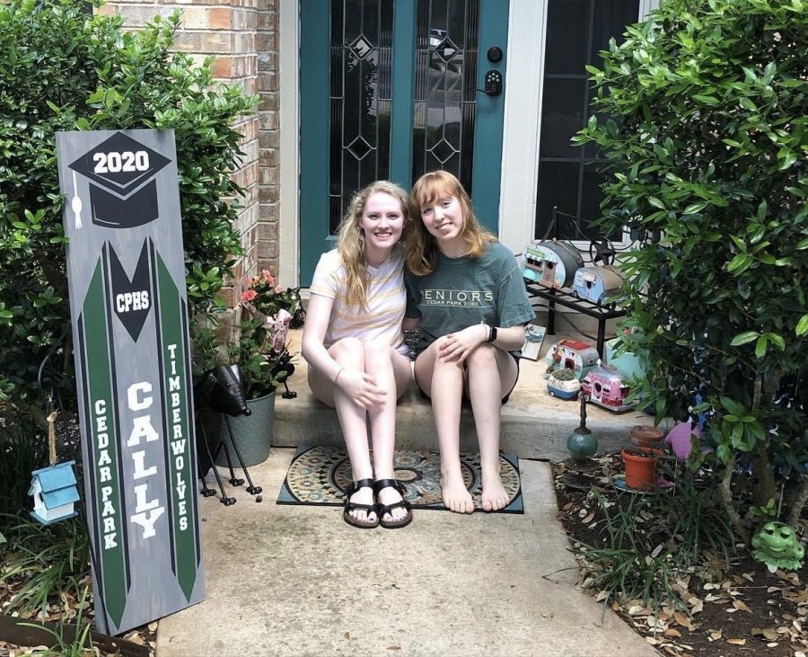 Sophomore Lexi Hall and Senior Cally hall show off their newly painted door. As far as creativity goes, I feel like it has helped me enjoy my time in quarantine because I get to spend time doing things I like to do like drawing and painting that I usually don’t have much time for with school” Cally said.