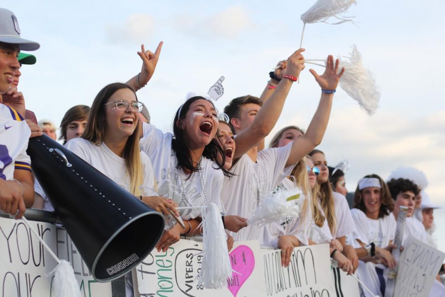 Seniors Iriyana Lipkin and Mallory Ramos show school spirit at the first white-out football game of the season in August. Ramos said that moments like these mean everything to seniors looking back on their high school experience and to the year that was left unfinished. I look forward to any chance we have to celebrate all we’ve been through and to be able to do it together,” Ramos said.  
