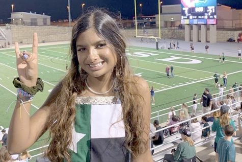 Holding up a Timberwolf, senior Romeela Kar shows her school spirit during the homecoming game against Cinco Ranch. Kar said she has never missed a football game during her senior year of high school due to her being a dance and cheer manager and being the football teams’ photographer. “I love CP football because of how it brings our entire community together,” Kar said. “Nights like the spring game are my favorite because the entire community comes out to support the T-Wolves.”