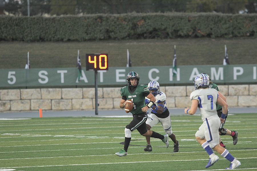 Quarterback Ryder Hernandez looks for a receiver to pass the ball to at the homecoming game against Georgetown. We [continue] to get better each week and I have a great time with my teammates, Hernandez said. It doesnt get much batter than coming out with a win every Friday with the guys youve been grinding with.