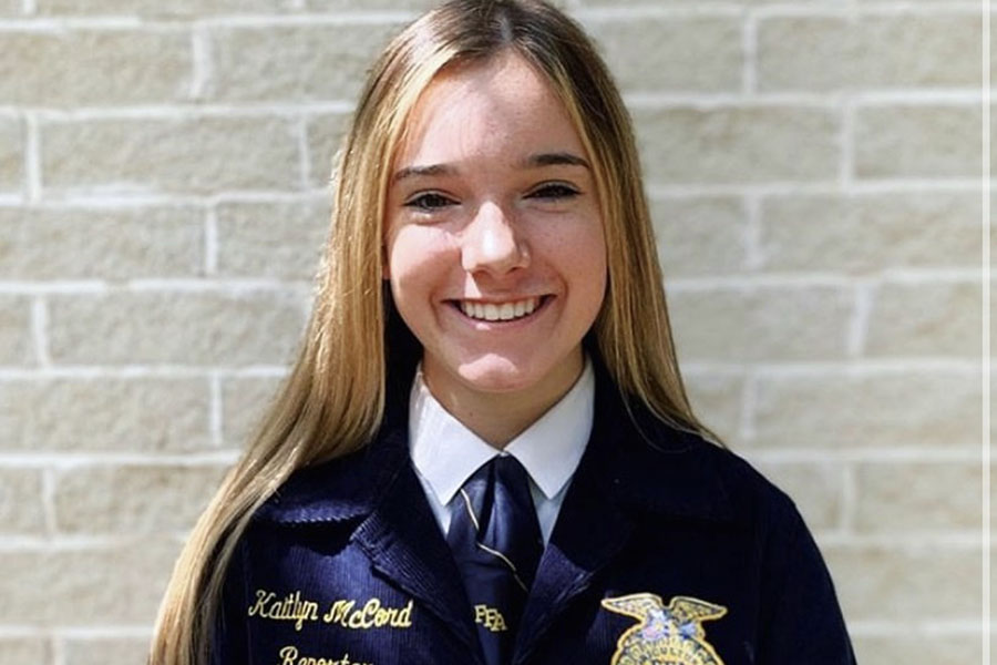 Smiling for the camera, FFA Club Vice President and junior Kaitlyn McCord poses for a photo after placing first place in senior creed speaking. McCord and others participating in public relations, job interview and chapter conducting will advance to State. 