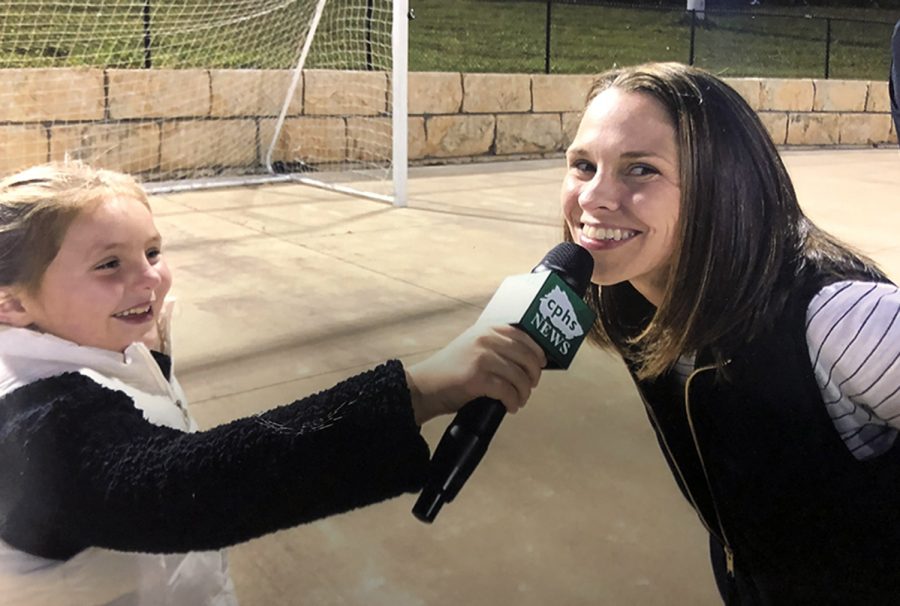 As her daughter, Aven Powell, pretends to be a CPHS News Reporter, AP Mitzi Powell smiles on the sidelines of Gupton Stadium in 2019. After three and a half years as assistant principal at CPHS, Powell is leaving to take the job as the districts Career Development Coordinator. I just want to say thank you to everyone who embraced me when I first got hired here and who has been part of my journey and coaching me and actually listening to me and supporting me along the way, Powell said.