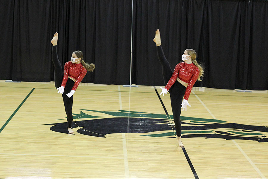 In sync, senior Celebrities lieutenant Kendall Richardson and junior Celebrities lieutenant Lindsey Lopez dance together at the Celebrities winter Show on Dec. 13. Having to deal with the cancelation of the spring show last year, Richardson was very excited for the winter show. “The spring show last year was canceled, so it felt incredible to be able to perform at the Holiday show this year,” Richardson said. “We had both in-person and virtual options available and we plan on continuing both those options in the future, so that is an amazing feature that Celebrities can now implement into shows.” 