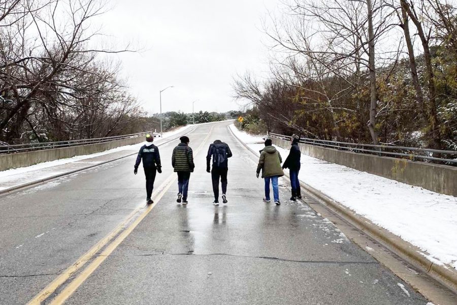 Sophomores Ben Mcdanald, Anthony Luparello, Kai Gray, Jack Polishook and Caleb Taylor walk down an empty street near Twin Creeks on Feb. 21. Two days before their return to school, the group decided to meet up one last time, later discovering that LISD had extended their bad weather break until Wednesday. “Most of the snow in our neighborhood had melted by then,” Gray said. “We wouldn’t have another break like this until March, so we decided to see each other.”