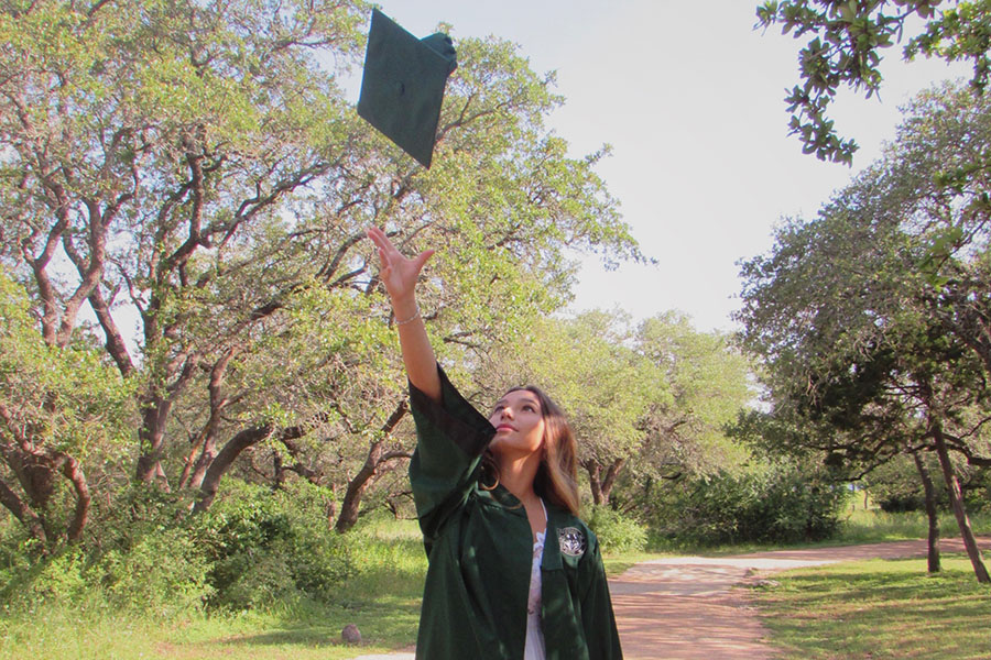 Finally+done+with+high+school%2C+senior+Lilly+McPherson+can+be+seen+tossing+her+graduation+cap+in+the+air.+According+to+McPherson%2C+changing+schools+was+very+difficult+for+her+since+she+went+to+a+private+school+and+went+from+a+class+of+35+to+around+500+people%2C+so+she+said+making+it+into+tennis+was+a+bit+harder+when+she+moved%2C+since+there+were+more+people.+I+took+a+break+from+tennis+because+I+was+scared+I+wouldn%E2%80%99t+be+good+enough+for+making+the+team%2C+but+I+got+over+my+fear+and+tried+out+and+I+kept+playing+because+it+was+the+sport+that+I+loved+the+most%2C+McPherson+said.+