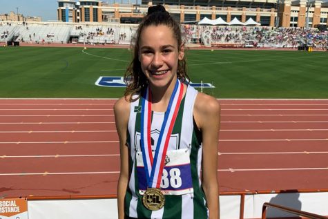 After running the 3200m event with a time of 10:26.49 at the track State Competition on May 7, freshman Isabel Conde De Frankenberg shows off her first medal of the day. Conde De Frankenberg also earned silver for her time of 2:09.21 in the 800m event. “It felt amazing to earn a gold medal at state,” Conde de Frankenberg said. “It was very exciting to know that my training over the season paid off. This state competition was very memorable to me because it was my first [state] competition, so it was just really exciting being able to go out there as a freshman and accomplishing what I did.”