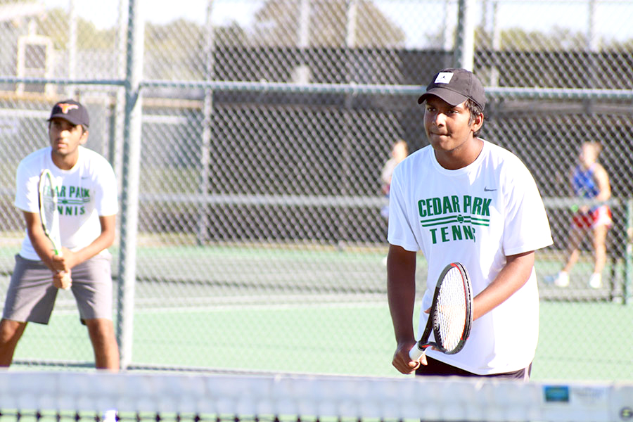 Eyes on his target, senior Rahul Kannam prepares to hit incoming tennis ball at the match against Leander on Oct. 2. Alongside his involvement in tennis, Kannam also wants to get involved in the process of business, particularly the financial aspect of it. “I would like to work in the finance area for business and understand companies’ finances and logistics,” Kannam said. “I would like to start a business, and I have tried to start one about t-shirts with a friend which ultimately fell through. I still had fun planning and designing it with him, though. In the future, maybe starting a business is very possible, but I would like to rather join a startup so I can learn more about the growing process before starting my own business.”
