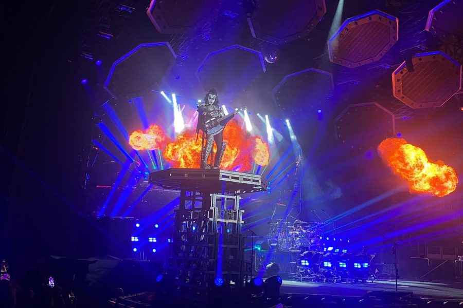 Playing the guitar, Gene Simmons performs as flames shoot out behind him. This is just one of the many times he was lifted on the platform. The 72-year-old musician created the band KISS in 1972 with lead singer Paul Stanley. 