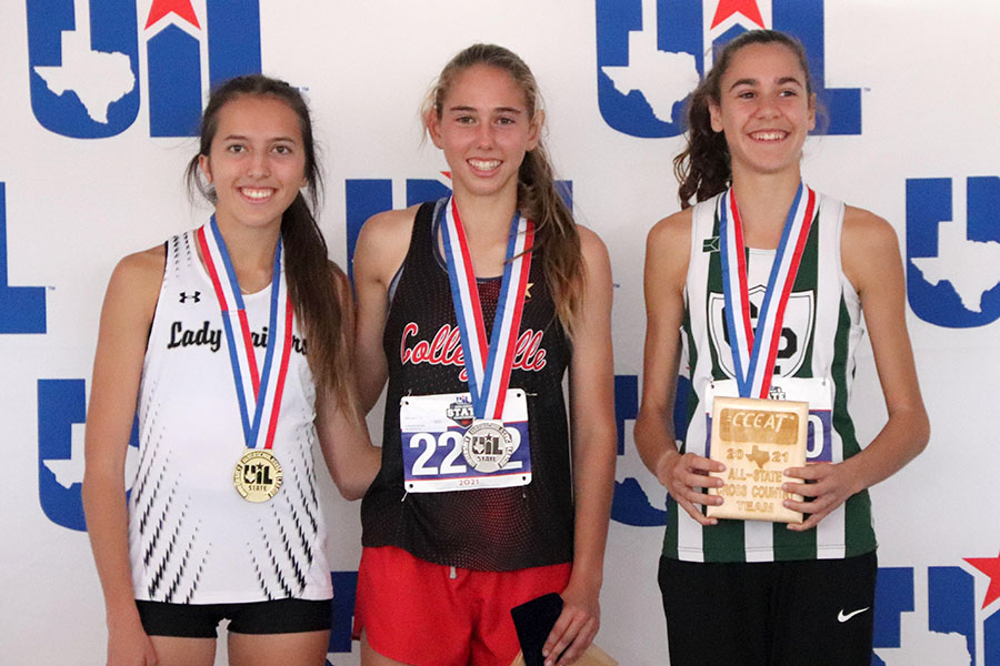 Sophomore Isa Conde De Frankenberg celebrates her bronze medal as she stands on the podium Friday afternoon with first place winner, senior Cameron McConnell from Canyon Randall, and second place winner, sophomore Allie Love from Colleyville Heritage.