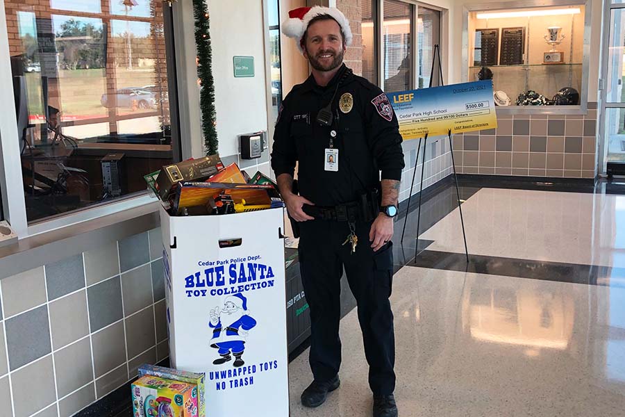 Officer Ott poses next to the overflowing Blue Santa toy donation bin. Blue Santa also takes monetary donations to help families in need. We will buy gift cards with the donations they can go to families with small kids and you can buy formula or baby food or whatever they may need, Officer Ott said. Most peoples donations are geared toward younger kids, but we want to include thirteen-fourteen- and fifteen-year-olds.