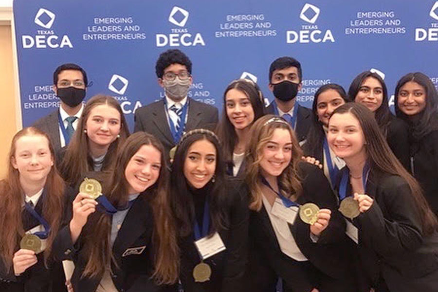 DECA teams pose with their medals at districts on Jan. 22, where 10 students advanced to the State Competition. This year Districts was held at Cedar Ridge high school and consisted of students from Leander, Round Rock, and Austin school districts presenting in either written or role play events. “Im really excited, not just for my team but for our entire chapter,” junior Ariana Balakrishnan said. “It’s a really big deal for us. Sending most of our competitors to State, especially after our year off, is really exciting cause now we’re back in person we can finally experience it like normal we get to see people get to talk to new members from other chapters it’s so just exciting.”