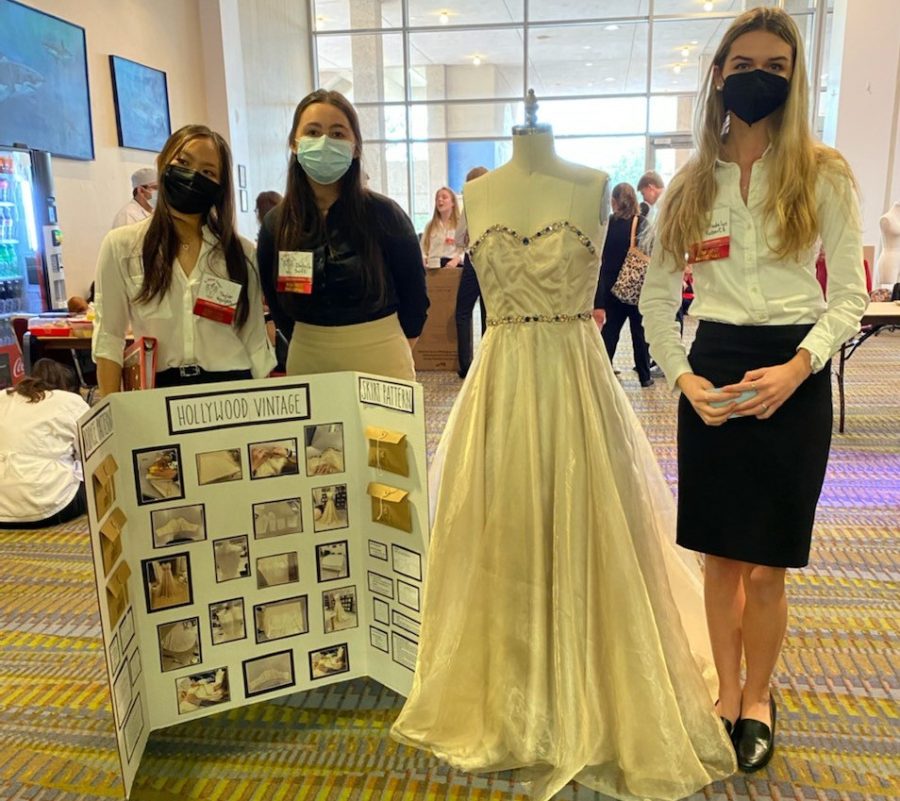 Juniors Taylor Nguyen, Isabella Swift and Madelyn Roberts pose in front of their Fashion Design project for FCCLA Texas Region V competitions. The project, which involved creating a fictional fashion brand called Hollywood Vintage focusing on special occasion gowns inspired by vintage Hollywood fashion, won second place and allowed the team to advance to state. “It was fun brainstorming all of the ideas and crafting a legitimate project using your own creativity and designs, Nguyen said. We had to present in front of experienced evaluators while hitting certain Texas Essential Knowledge and Skills, or TEKS, standards of fashion design, so while we felt like we did a decent job, we were not at all expecting second place.” 