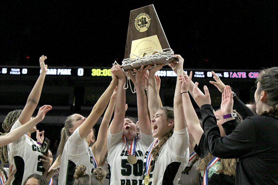 Raising their UIL plaque in the air, senior Megan Woods and her teammates yell in celebration of winning the State Championship. The Lady Timberwolves beat Frisco Memorial’s Warriors 45-40 in double overtime. “We had to work hard and stay disciplined and focused for months, so finally achieving our set goal was indescribable,” Woods said. “As seniors, we always talked about leaving a legacy behind and having an undefeated season with being back to back state champions does just that, which is an amazing way to finish off our high school basketball careers.”