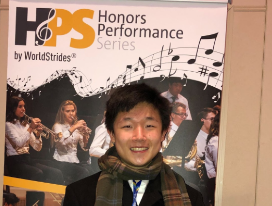 Sophomore Bowie Wu takes a photo in front of a Honors Performance Series Poster in New York City. Wu qualified out of nearly 10,000 contestants to become one out of around 100 young musicians to perform at Carnegie Hall under director Kirt Mosier. I was pleasantly surprised when I saw the email notifying me that I was accepted into the program,” Wu said. “I don’t remember too much about the etudes or the essay we had to write about ourselves, but I recall not thinking much of it. Experiences like playing at Carnegie Hall will stick with me forever as I continue to develop my playing.” 