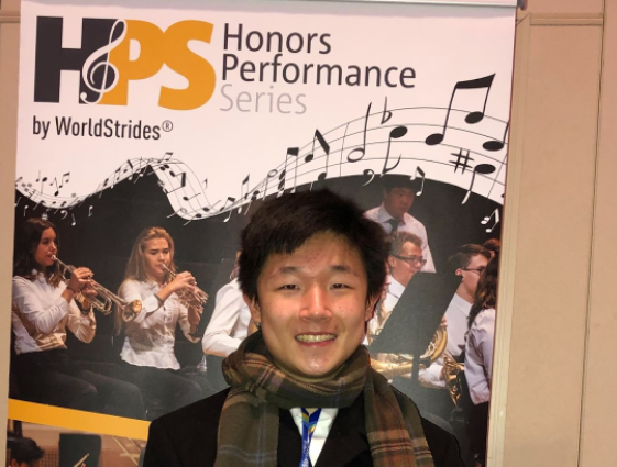 Sophomore Bowie Wu takes a photo in front of a Honors Performance Series Poster in New York City. Wu qualified out of nearly 10,000 contestants to become one out of around 100 young musicians to perform at Carnegie Hall under director Kirt Mosier. "I was pleasantly surprised when I saw the email notifying me that I was accepted into the program,” Wu said. “I don’t remember too much about the etudes or the essay we had to write about ourselves, but I recall not thinking much of it. Experiences like playing at Carnegie Hall will stick with me forever as I continue to develop my playing.” 