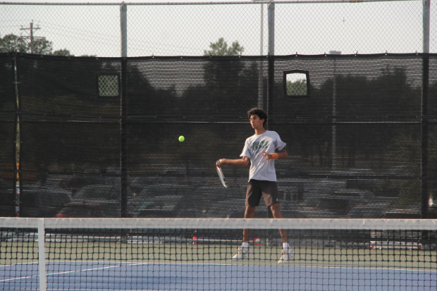 Senior+and+varsity+tennis+athlete+Ganesh+Sadasivan+prepares+to+hit+an+incoming+tennis+ball.+Sadasivan+placed+second+and+advanced+to+Region+UIL+in+the+boys+double+category+at+District+with+senior+and+varsity+tennis+athlete+Jay+Kannam.+%E2%80%9COur+prior+tournament%2C+which+was+%5Bat+the+Kemah+Boardwalk+in+Houston%5D%2C+was+a+pretty+tough+one+and+we+managed+to+win+that%2C%E2%80%9D+Sadasivan+said.+%E2%80%9CSo+we+definitely+had+a+lot+of+confidence+going+into+District.%E2%80%9D+