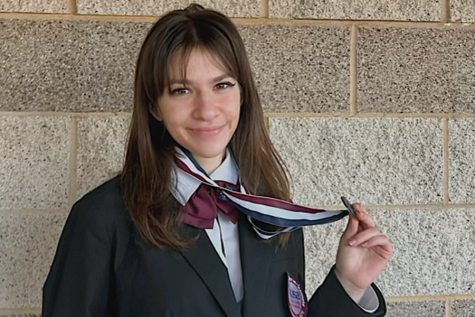 Holding up her medals, senior Arina Gart finishes HOSA competition season. HOSA advanced to the state level this year. I’ve wanted to be in the medical field for forever,” Gart said. “But this year, since I was in practicum, I got a lot more experience. We also participated in the Medical Reserve Corps, so we partnered with them and we made first-aid kits for the visually impaired, and that experience made me realize it was something I really wanted to do in the future.