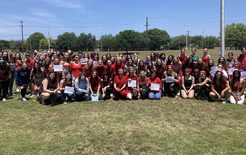 More+than+50+students%2C+all+donned+in+red+T+shirts%2C+pose+for+a+group+picture+at+the+front+grounds+of+the+school%2C+holding+various+signs+and+symbols.+These+students+all+engaged+in+a+silent%2C+peaceful+protest+regarding+the+Roe+v.+Wade+and+abortion+situation+as+of+now.+%E2%80%9CIt+felt+kind+of+empowering%2C%E2%80%9D+senior+Aleksae+Watson+said.+%E2%80%9CBecause+they+were+all+there+for+the+same+thing.+We+all+are+aware+that+what%E2%80%99s+going+on+isn%E2%80%99t+right.+I%E2%80%99d+say+it%E2%80%99s+not+appropriate.+We+all+deserve+our+rights+and+our+freedoms+and+it%E2%80%99s+just+being+stripped+from+us.%E2%80%9D