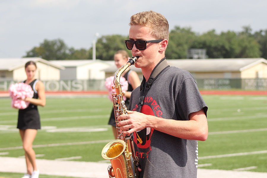 Playing his saxophone, senior Jacob Cohen performs at one of the outdoor pep rallies. Cohen, who has been playing the saxophone since middle school, was named co-grand champion for Cedar Park’s soloist competition this year. Although he will not be majoring in music at University of Texas at Austin, he said he still wants to pursue it. “I want to continue playing the saxophone because it’s always been a passion of mine,” Cohen said. “I’m excited to meet new people in the band world, [make] new relationships and [get] involved in the college band experience.”