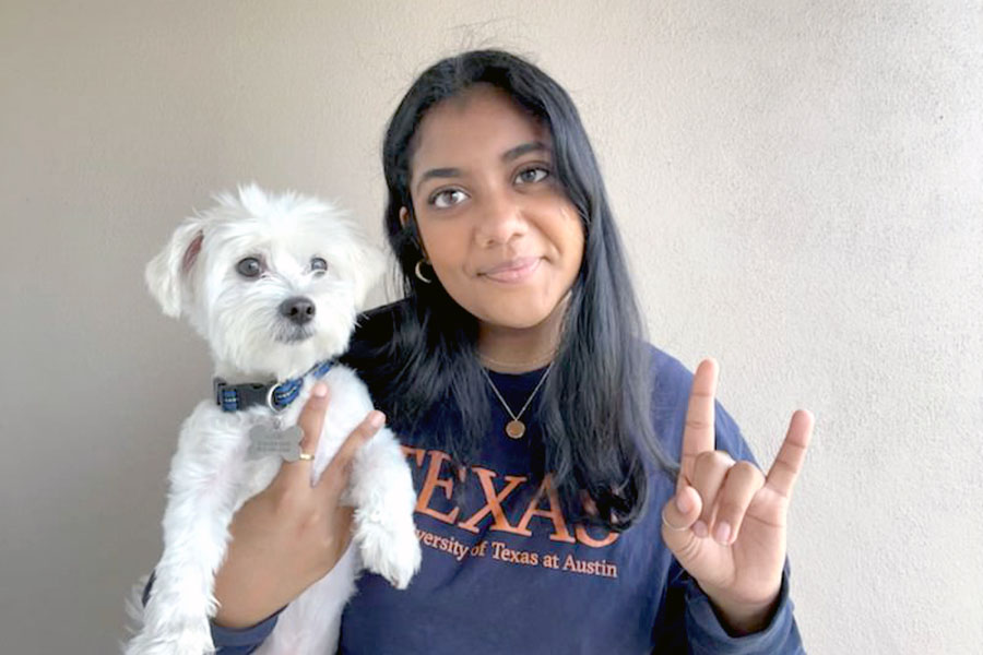 Smiling with her dog Hari for her commitment to the University of Texas at Austin in the fall, senior Aashna Ravi poses at her home. Ravi plans to major in Health and Society, an interdisciplinary program within the College of Liberal Arts. “As an aspiring healthcare professional, being able to get that higher understanding of how people are affected by the background they come from will be especially helpful as I go forward into a career that is very people oriented,” Ravi said. “Going forward I hope that there’s a lot more growth in terms of accessible healthcare.”