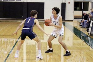 Showing off his skills, senior Jacob Swoboda looks for an open teammate. He will continue his basketball career in the fall at Oklahoma City University. “I’m super excited to get to play in college and continue my lifelong passion and dream that I’ve put so much time and effort into,” Swoboda said. “It’s sad knowing it’s my last season here after spending so much time in the program. I’m going to miss the moments with my teammates and getting to spend time working hard with them on the court, but also the memories made together off the court.” 