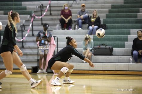 Eyes on the ball, senior Kymorah Carter looks to pass the ball. Carter has helped lead her select volleyball team for seven years and implemented those leadership skills to showcase herself during the college recruiting process.  “These skills I learned helped me to speak up for myself and pushed me to be the best I could possibly be during the process,” Carter said. “Having the opportunity to be in these leadership positions  has helped me grow tremendously and to be comfortable in my own skin.”