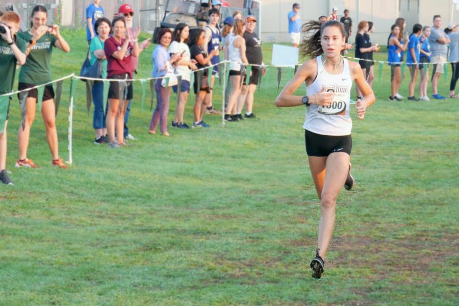 With the finish line in sight and a 15-second lead, junior Isabel Conde De Frankenberg pushes her way through the final stretch of the Cedar Park Invitational. Conde De Frankenberg would go on to win the varsity girls 5K race for the second year in a row. “It was a good turnout, it was really fun,” Conde De Frankenberg said. “I love our school course, it was good being able to run on there and represent your own course.”
