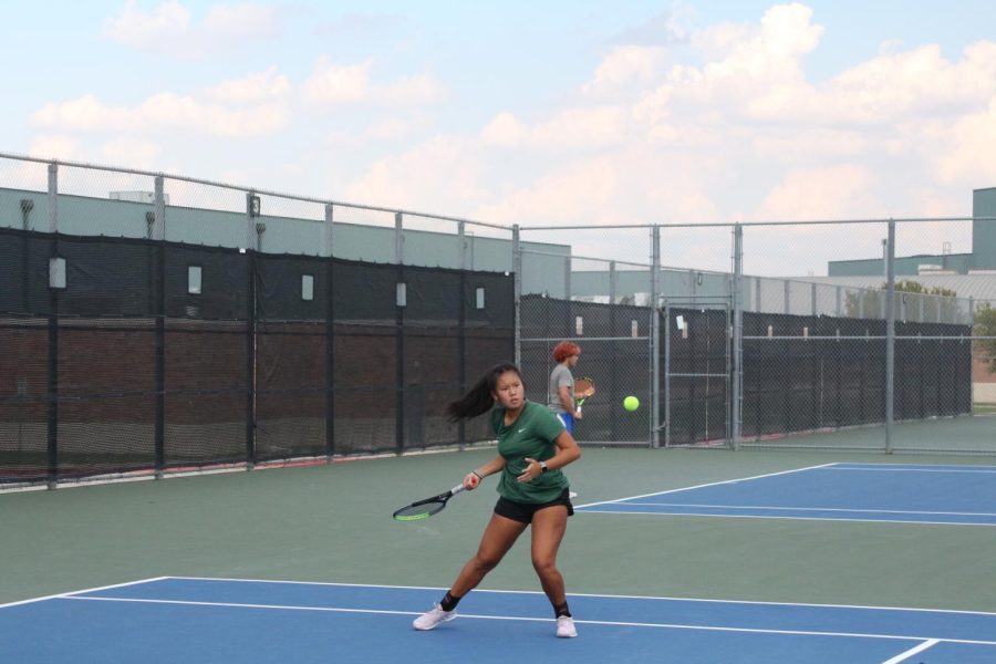 Focused+on+the+game%2C+senior+captain+Katie+Tran+prepares+to+hit+a+ball+in+a+match+against+Leander+High+School.+Varsity+Tennis+now+moves+to+prepare+for+their+spring+season%2C+which+is+more+about+individual+playing%2C+while+the+fall+is+more+team-oriented.+%E2%80%9COur+season+went+great%2C%E2%80%9D+Tran+said.+%E2%80%9CWe+finished+third+in+district+after+winning+against+Leander%2C+who+we+lost+to+earlier+in+the+season%2C+which+felt+really+good.%E2%80%9D