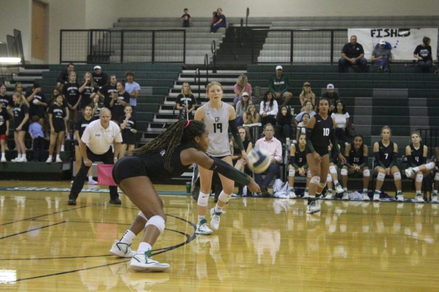Keeping her eye on the ball, freshman Joy Udoye watches closely as the ball bounces off her arms and into the setters hands. Udoye said her time on varsity this season allowed her to have fun with other people. “Ever since tryouts my time on varsity has been extremely fun,” Udoye said. “It’s amazing to get to spend this time with such great people while playing the sport that I love.”