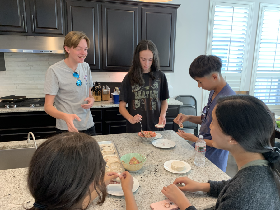 Members of the Mandarin Club assemble dumplings at their Dumpling Social. The social, which occurred in October, is one of the clubs monthly special events, which all try to offer them the opportunity to engage in a special aspect of Chinese culture. “I’m interested in learning more about Chinese culture and Taiwanese culture in general, so it helps me see more into it,” senior Natalia Sanchez-Mejorado said. “[My favorite event] would definitely be the dumplings. We did it step-by-step, basically, and it turned out really good, and we also hung out, with the [club member’s mom] teaching us a few words.” (Photo Courtesy of Eden Yu)