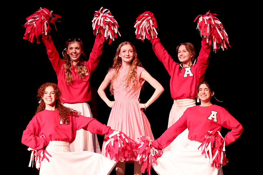 Surrounded by cheerleaders, senior Makayla Cox stands center stage as she plays Jenny in the Theatre’s production of “Big Fish.” In the show, Edward Bloom, played by junior Aidan Cox, tells stories of his youth and the friends he made in high school, along with the story of his peppy high school girlfriend, Jenny. “The feeling of performing this scene was just a fun joy,” Cox said. “I loved the dance break because it was such a burst of excitement.”