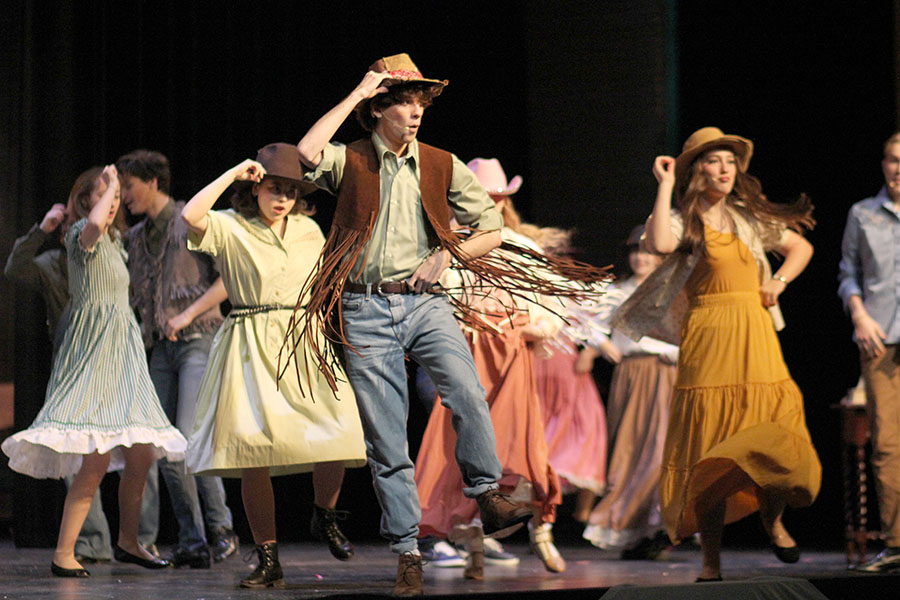 Dancing as a cowboy in the number “Showdown,” senior Brady Allen performs in theater’s production of “Big Fish.” The show was worked on by the theatre department throughout the fall semester and featured many student actors and actresses. “It was really fun [preparing for this role] because our choreographer, Audrey Johnson, was really willing to work things out with those of us who weren’t as skilled in dancing,” Allen said. “I think [the show] went really [well]. It definitely was one of the better performances we’ve put on in the last four years that I’ve been here and doing productions; I am very proud of it and everyone that was in it.” 