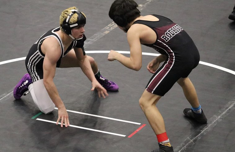 Ready+to+pounce+at+his+opponent%2C+sophomore+Max+Brandt+considers+each+way+he+could+pin+his+opponent.+During+his+regular+season%2C+he+went+24-3.+%E2%80%9CWrestling+is+my+whole+life%2C%E2%80%9D+Brandt+said.+%E2%80%9CI%E2%80%99ve+done+it+since+I%E2%80%99ve+walked.+It+teaches+you+a+lot+of+good+stuff+on+how+to+be+a+better+human%2C+and+you+can+definitely+learn+a+lot+rather+than+just+how+to+pin+someone.+You+can+learn+how+to+defend+yourself+-+it+just+makes+you+a+better+person%2C+I+think.%E2%80%9D+%28Photo+Courtesy+of+Max+Brandt%29