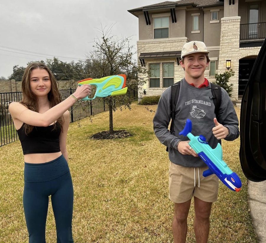 Posing for the picture as evidence of his “assassination”, senior Paisley Schalles holds up her water gun to her target, senior Dominic Ridder. The game of Senior Assassin began on March 1 and will be played by 176 seniors across campus. “I was so tired,” Ridder said. “I was kind of just surprised at first because I live pretty far, so I didn’t expect anyone to be out there. I mean, it was interesting, I was just super tired, so it surprised me a little bit. But I’m still going to help out my team and everything. So far it seems pretty cool, the water guns are the best option.”