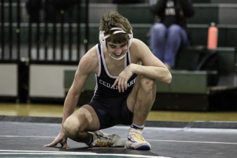While feeling the rush of emotions after reaching 100 wins in his wrestling career, senior and varsity wrestler Kane Sistrunk celebrates his win against Comal Canyon. Attaining this achievement is a rare occurrence in the high school wrestling world. “It was super relieving because I knew there were celebrations and fun things like that,” Sistrunk said. “My best friend was telling everyone I had 99 wins before the match, which is nerve-racking [to try and meet everyone’s expectation of me reaching 100]. It was super fulfilling to get [the win].”
(Photo courtesy of Kane Sistrunk)
