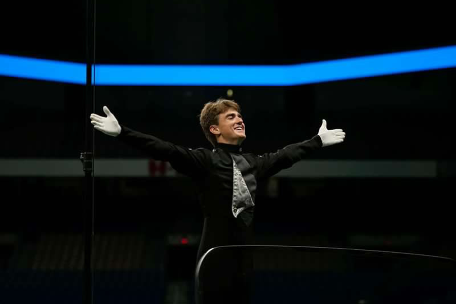 Senior Nick Doluisio prepares to take his final bow as a drum major for the CPHS band. On Nov. 5, 2022, the CPHS band ended the marching season with BOA San Antonio. “The role of the drum major and what it has provided me the opportunities to do is just so fulfilling,” Doluisio said. (Photo courtesy of Kate Noren)