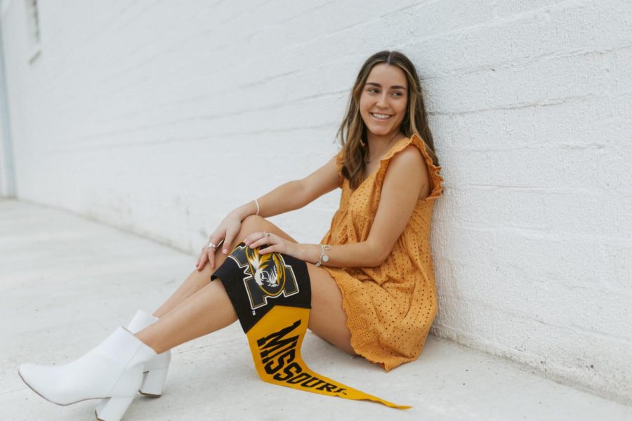 Holding+her+Mizzou+flag%2C+senior+Abby+Martinez+sits+for+her+senior+photos+in+Austin.+Martinez+said+she+is+excited+for+this+next+chapter+and+feels+prepared+to+take+on+the+challenges+that+will+come.+%E2%80%9CThroughout+my+high+school+career+I+have+made+lots+of+connections+and+learned+plenty+of+life+long+goals+to+take+with+me+through+college%2C%E2%80%9D+Martinez+said.+%E2%80%9CI+know+Mizzou+is+the+perfect+place+to+pursue+my+journalism+degree.%E2%80%9D+%28Photo+courtesy+Samantha+York%29