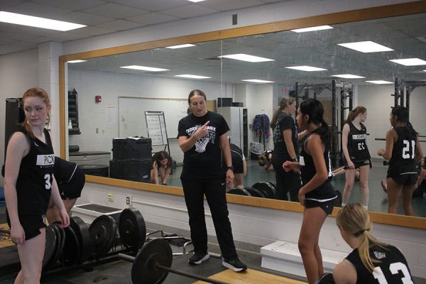 In the weight room, Coach K directs her basketball athletes as they get a lift in during their athletic period. According to Coach K, she hopes to not only continue the success of the program but also make them better players and people. “I feel like one of my biggest roles is to be a mentor and a person they can look up to,” Coach K said. “Someone who will be there for them long after they’re gone from the program.”
