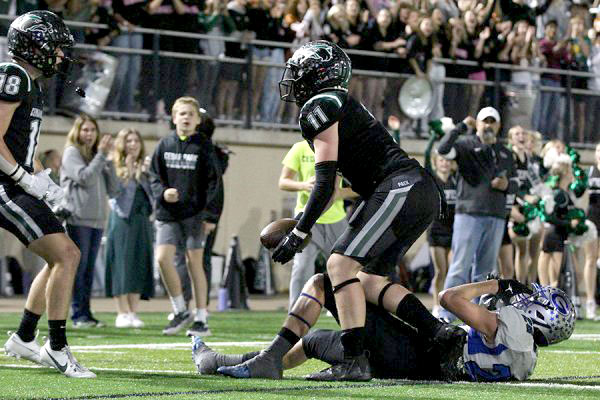 After scoring the game winning touchdown during the last regular season game on Nov. 3, senior tight end Luca Wilson celebrates with his senior teammate, wide receiver Carter Woehl. The team will face Canyon High School tonight at 7:00 p.m. “I mean I’d say we’re pretty excited,” Wilson said. “For the seniors, we don’t want to go home yet, it’s our last season together and we just want to try and make a long run. We just want to win and get a gold ball, and keep getting more gold balls.” Photo courtesy of Tylie Biggs, Tracks Yearbook Staff