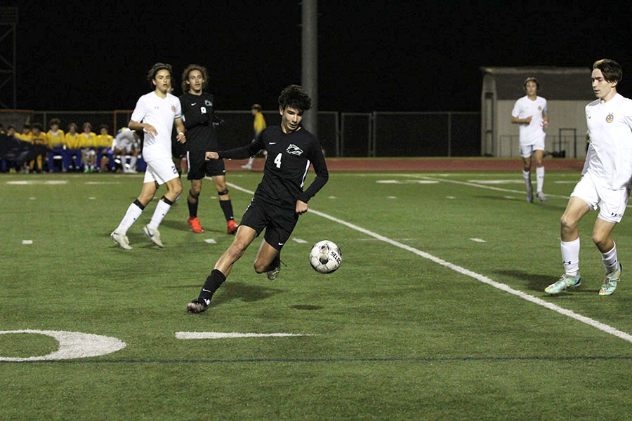 Taking control of the ball, junior striker Riley Baroldy plays during one of last season’s Varsity soccer playoff games. That season was his last one playing for the school, as he is now playing for Capital City’s MLS Next team. “I miss spending time with my teammates on the Cedar Park soccer team,” Baroldy said. “Im excited for the rest of junior year though because Im an upperclassman so I feel like its easier and I have more rights so it’s more fun.”

