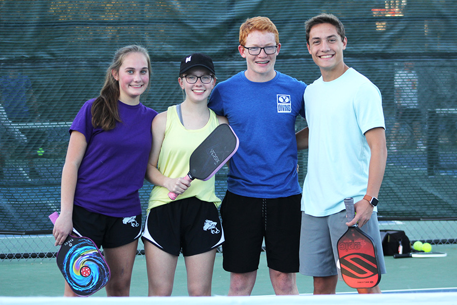 Smiling at the camera with paddles in hand, my siblings and I pose for a picture at the end of the school’s pickleball club. Pickleball is a wonderful sport simply because it is just fun. It is so satisfying to hit a ball right where you intended it to go, to work with your teammate to win against your opponent and to master a skill you’ve worked so hard to perfect. I know that if you give pickleball a shot, you can experience these things too, and you’ll soon find yourself obsessed.
