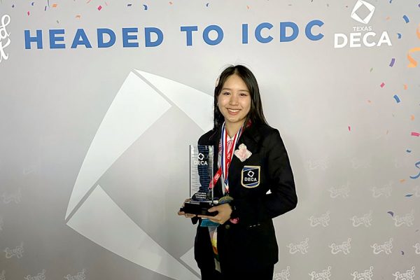 After advancing to ICDC, senior Danielle Tran poses with her DECA trophy. Tran is the president of the Cedar Park DECA chapter this year. “DECA, beyond the neon blue raves, serves as a gateway into business for anyone looking to improve their public speaking, management skills, marketing strategy, entrepreneurial knowledge or even social life,” Tran said. “You will come out a different person, and that’s coming from someone who used to have zero professionalism and spoke like a Discord mod.”
Photo Courtesy of Dani Tran
