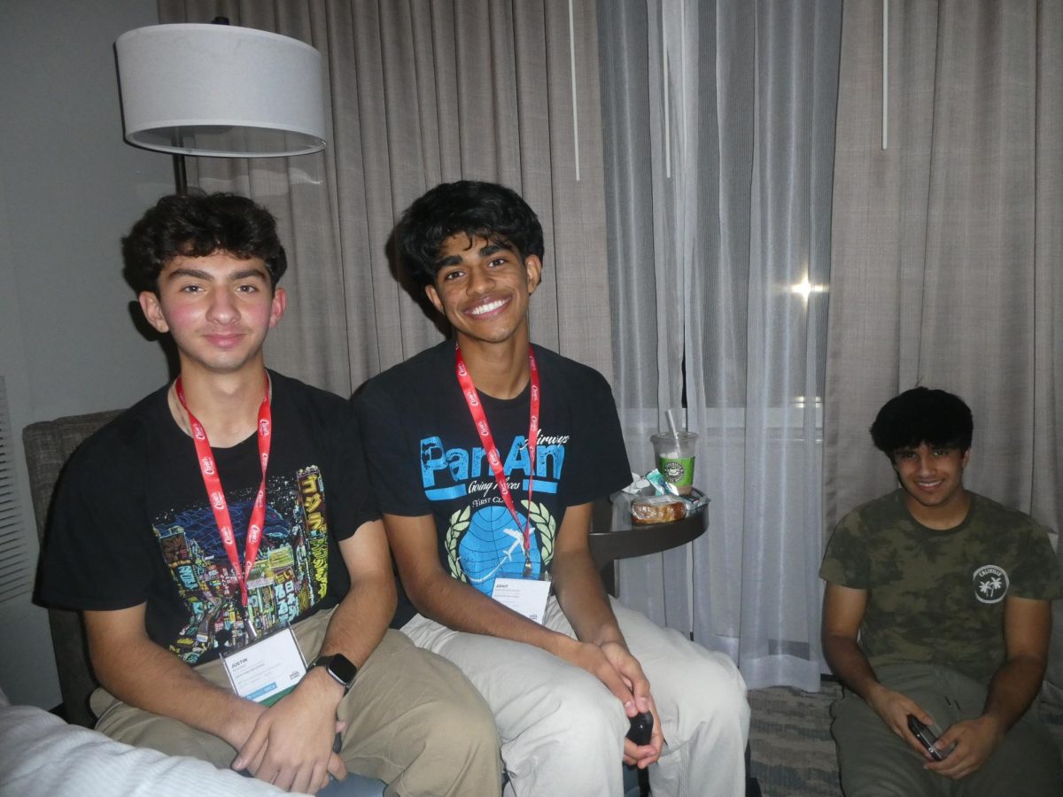 Smiling for the camera, Junior Adhit Eswaramoorthi and his fellow DECA member Justin Khadivi and Aryan Anarkat as they stay in their room during the state competition in Houston. Eswaramoorthi, Anarkat, and Rushil Mehta participated in the event Franchise Business Plans and advanced to the DECA International Competition. “I think being in DECA and talking to different people from different schools allowed me to expand how I view and go about meeting new people, Eswaramoorthi said. Which connects to robotics and the work ethic you have to have.