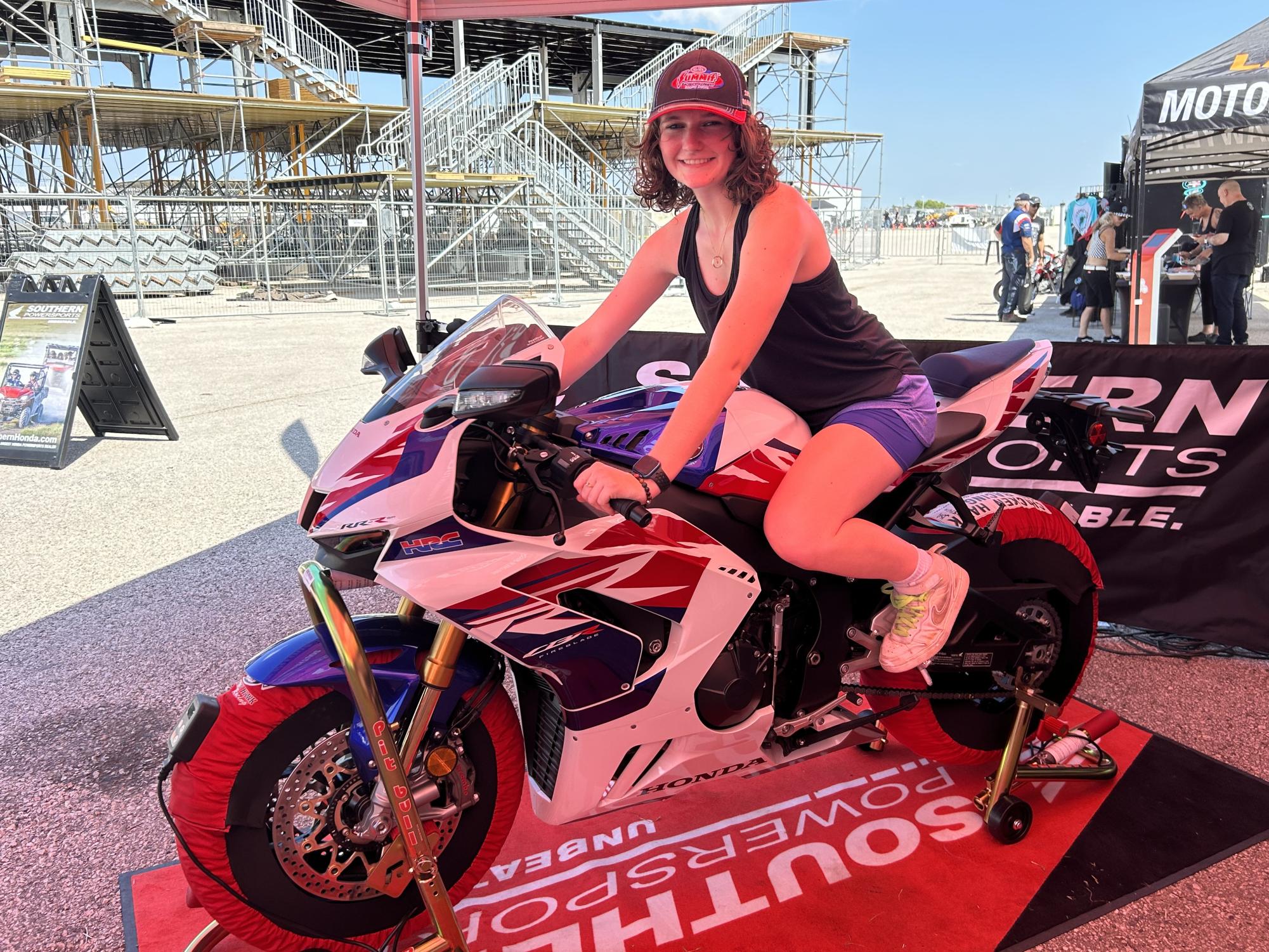 As I am smiling as hard as I can, my mom snaps a picture of me on one of my dream bikes, a Honda CBR1000RR Fireblade SP, that I stumbled upon during my experience at MotoAmerica.